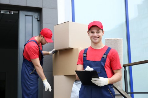 Moving team preparing boxes with safety equipment