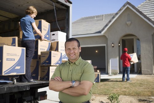 Loading furniture and boxes into a van for Docklands transport