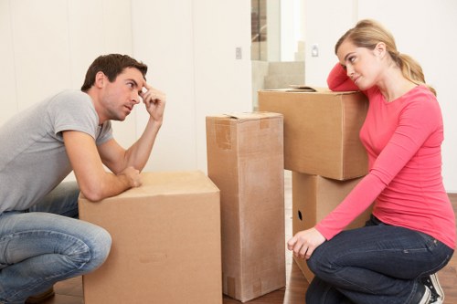 Local removal company loading boxes and furniture in Docklands